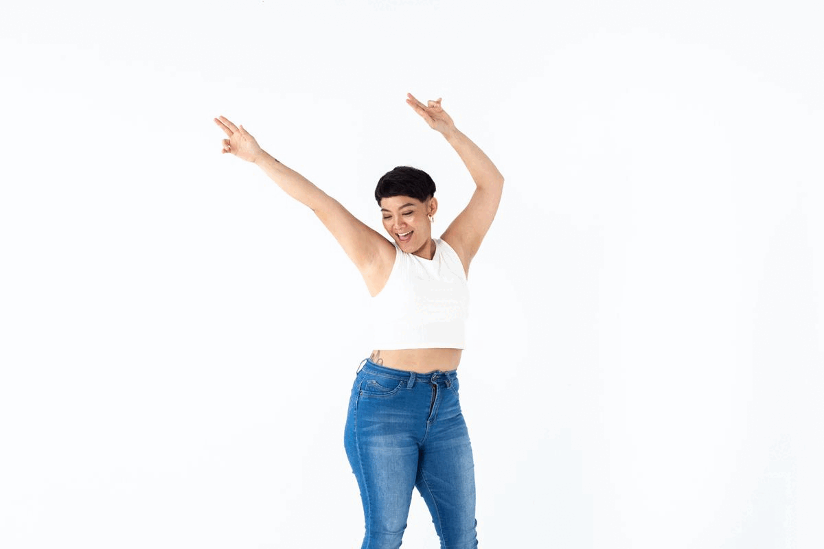 Gif of Tawny Ann De La Peña dancing in celebration after passing her Life Coach Certification test through The Life Coach School.