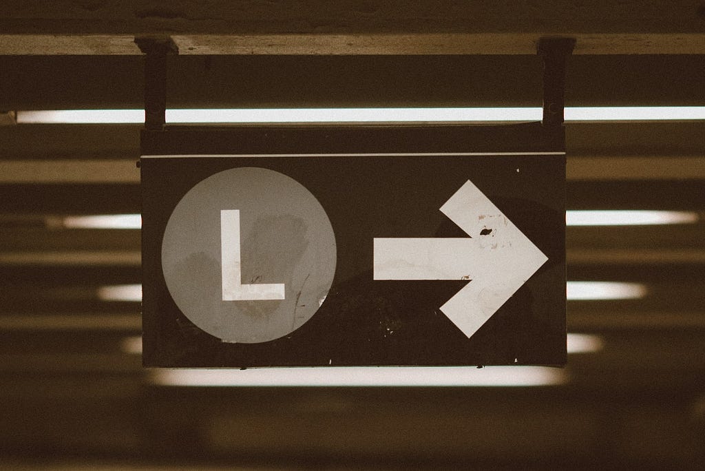 A photo of an “L” train subway sign