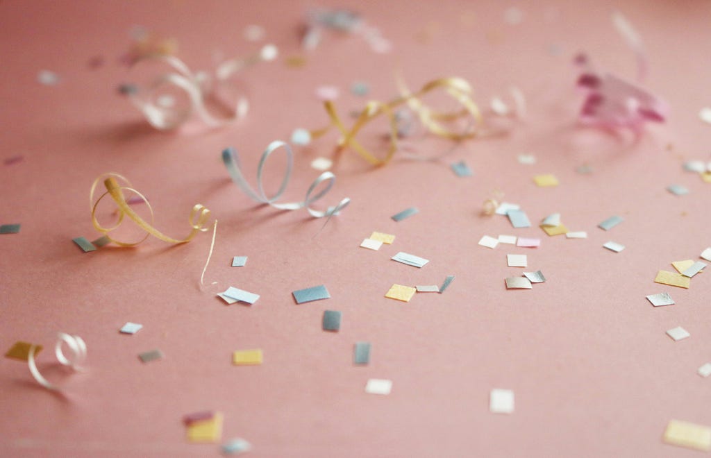 Confetti and ribbons laying on a floor