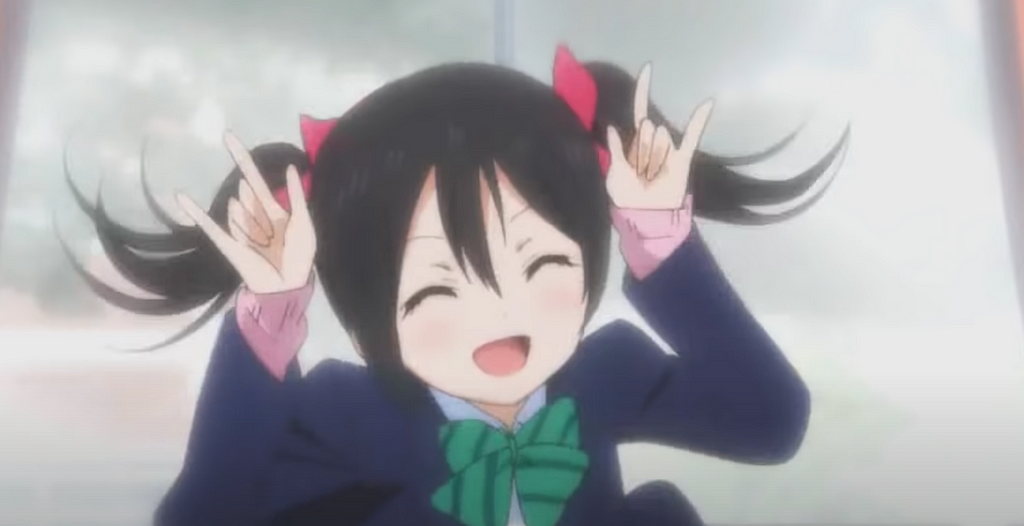 An image of character Nico Yazawa doing her signature ‘Nico Nico Nii’ pose