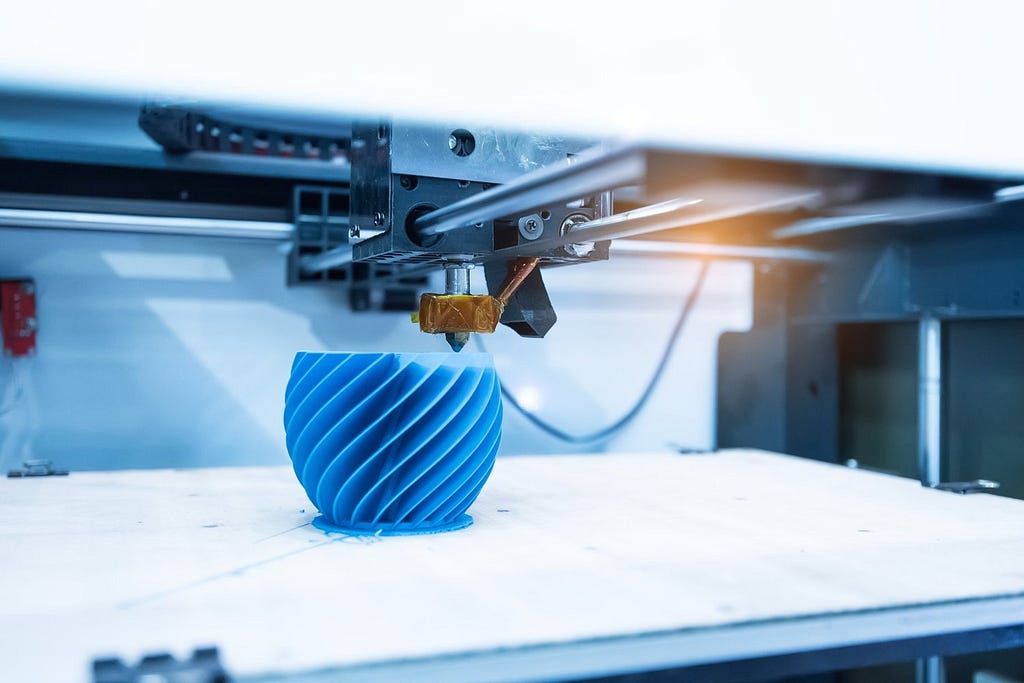 A 3D printer can create unique difficult-to-make designs but can create imperfect and imprecise recreations of a design.