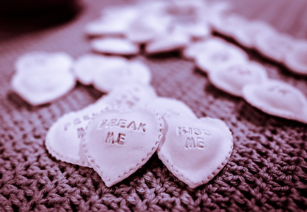 candy hearts made by Claudia Solorzano in the shape of ravioli with crimped edges and made of porcelain