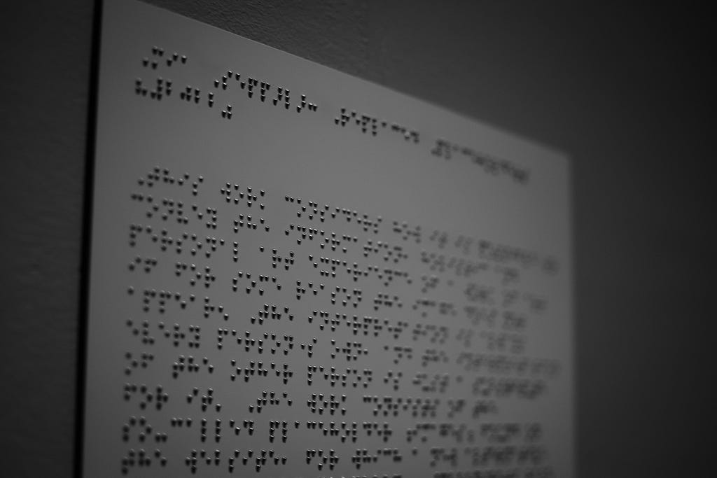 A piece of paper with braille letters