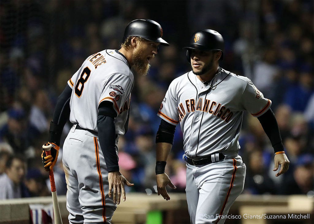 Hunter Pence and Gregor Blanco celebrate after Blanco scored on a sacrifice fly hit by Brandon Belt in the third inning.