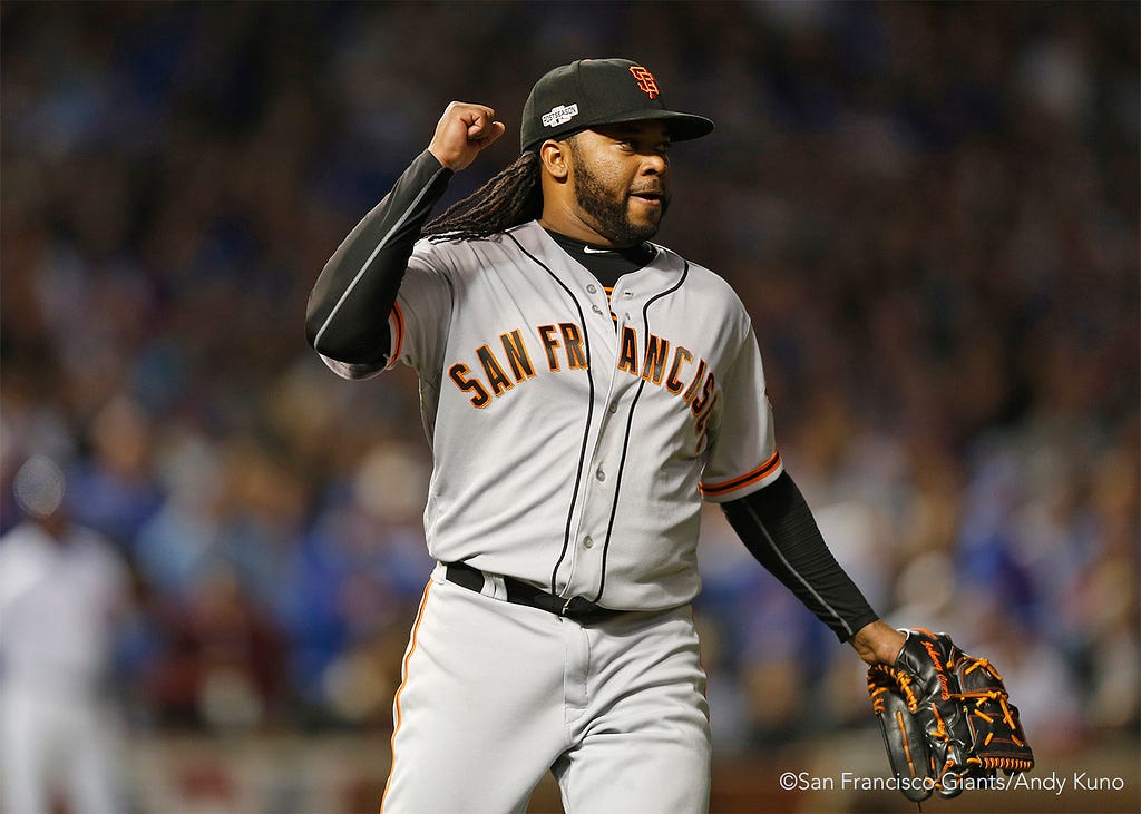 Johnny Cueto reacts after striking out the side in the sixth inning.