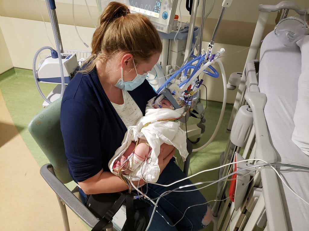 Baby Rowan in the arms of his mother Amber — Invitae genetic testing patient stories