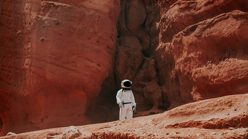 “Astronaut wearing a space suit standing on the red dusty surface of Mars, ready to depart the planet”
