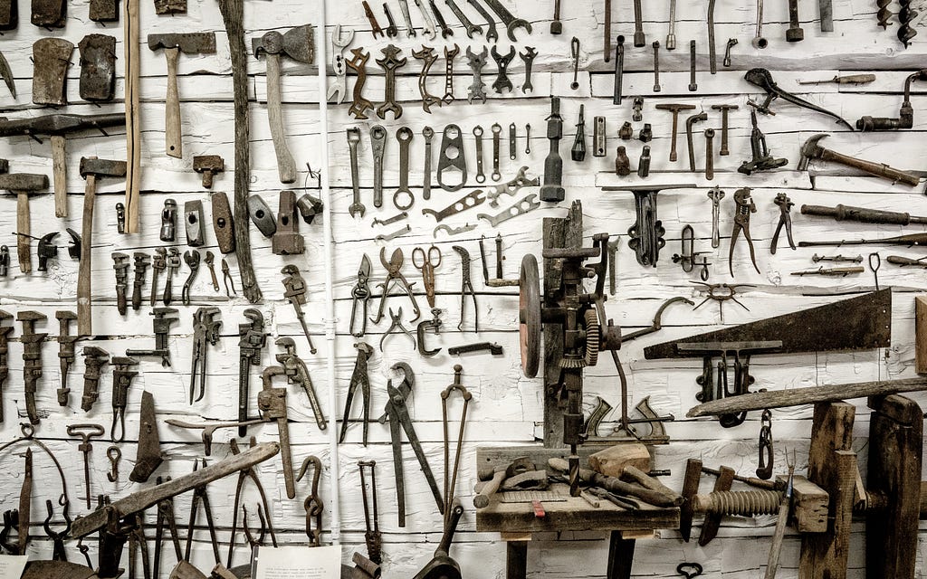 This wall has many tools hanging on it. Too many tools to choose from? Focus on Launch School’s PEDAC toolbox.