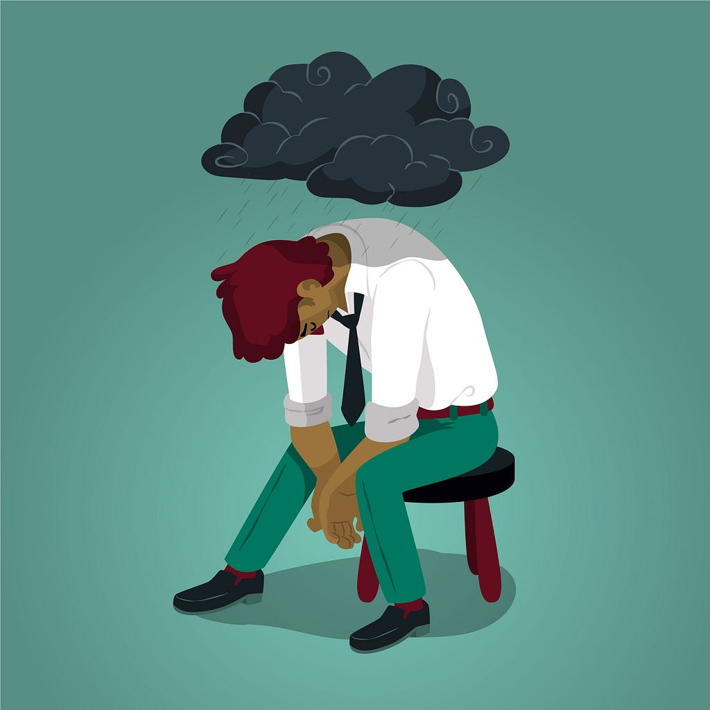 A vector drawing of a man sitting on a stool; he’s slouching with a sad and hopeless expression on his face. There’s a dark raincloud above his head which is raining on him.