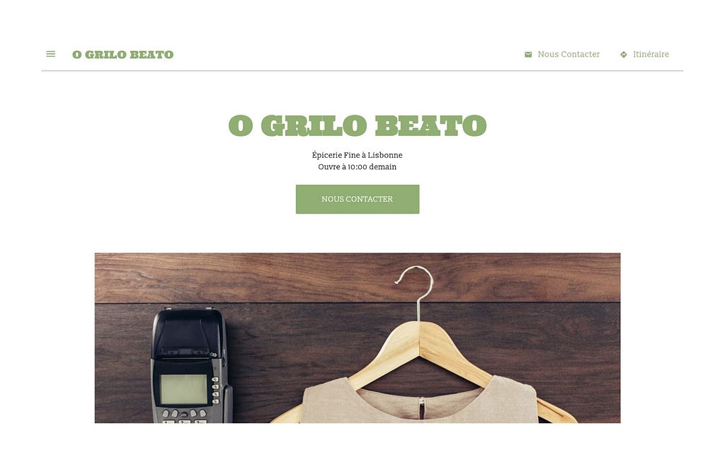 Website printscreen, the name of the store “O Grilo Beato” in green and bellow a picture with a credit card machine and a clothes hanger.