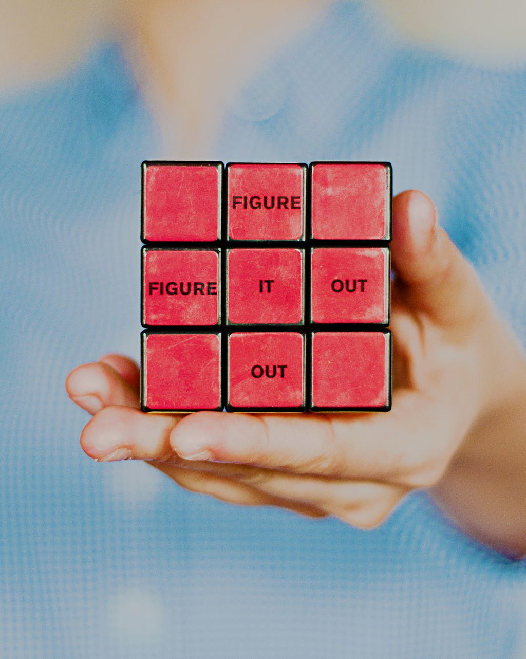 a Rubic’s cube with the text “figure it out”