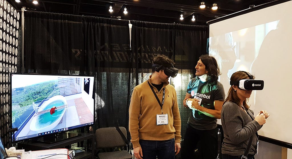 Couple of visitors are trying virtual reality at BuildEx Vancouver