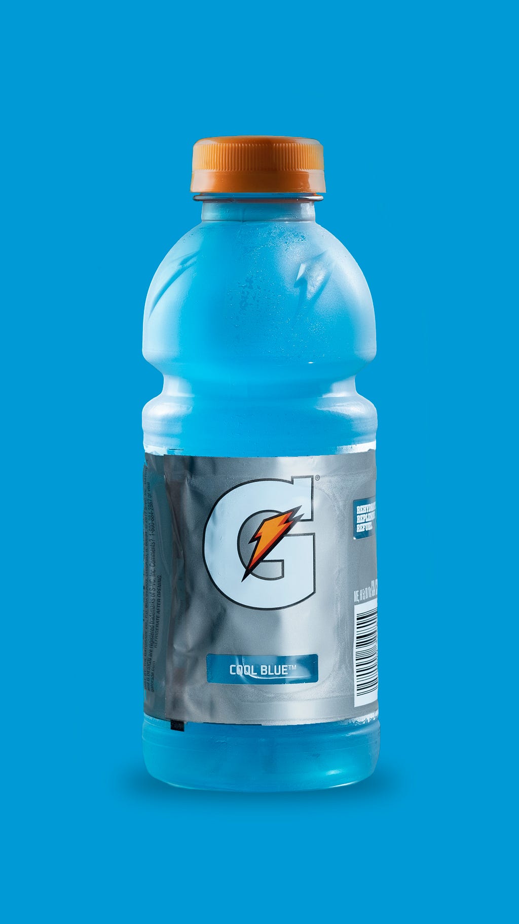 A Gatorade bottle isolated on a blue background