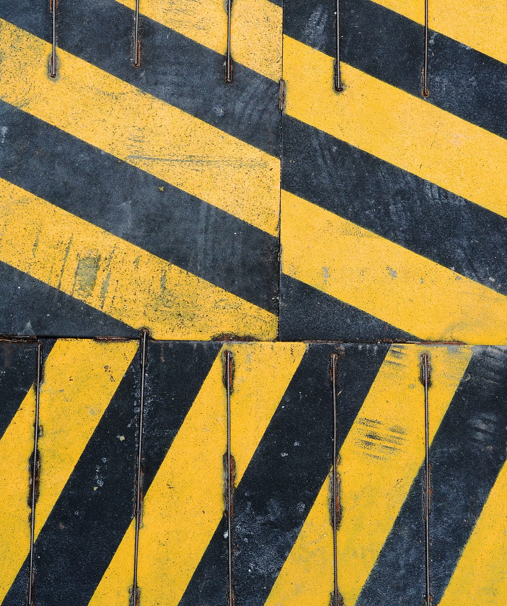 A  yellow and black striped sign