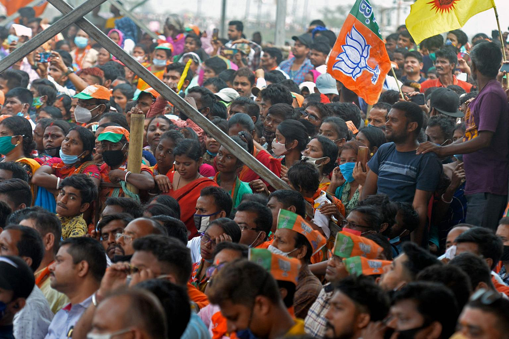 Supporters attend a public rally being addressed by Indian PM Narendra Modi (not pictured) on April 10, 2021. PHOTO: AFP