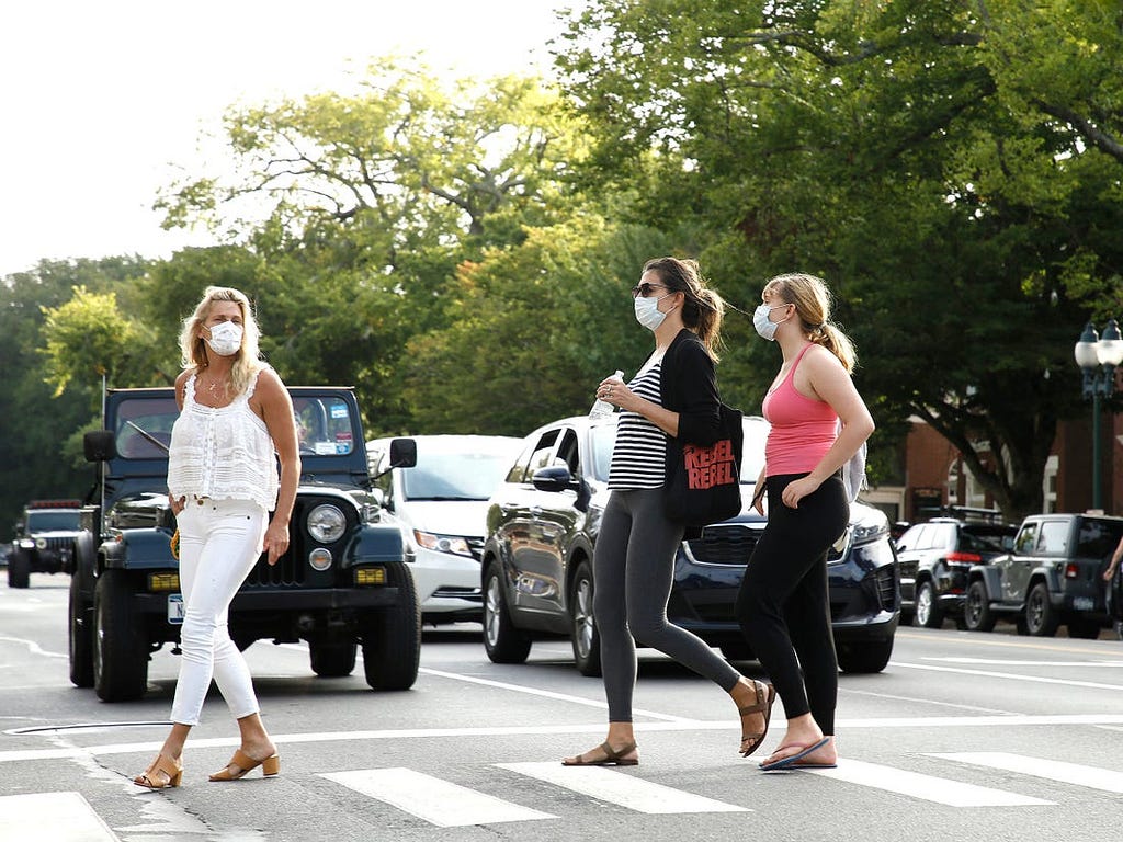 Women crossing the street in East Hampton, New York.