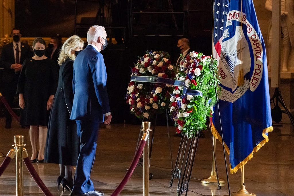 President Joe Biden and First Lady Dr. Jill Biden pay their respects to U.S. Capitol Police Officer Brian Sicknick, who lies in honor in the Rotunda of the U.S. Capitol, on Feb. 2, 2021.