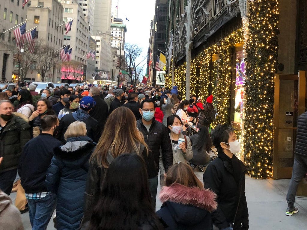 The crowd outside of Saks Fifth Avenue.