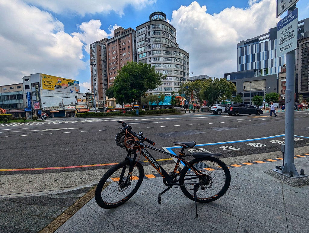 My bike outside of the Fengyuan Railway Station. In the background is Fengyuan District.