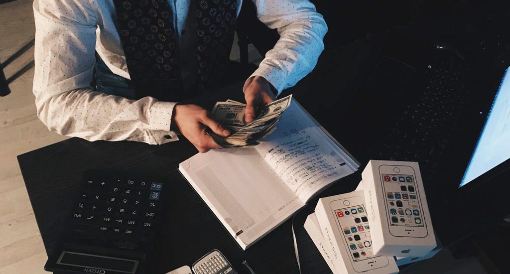 Accountant counting business cash flow