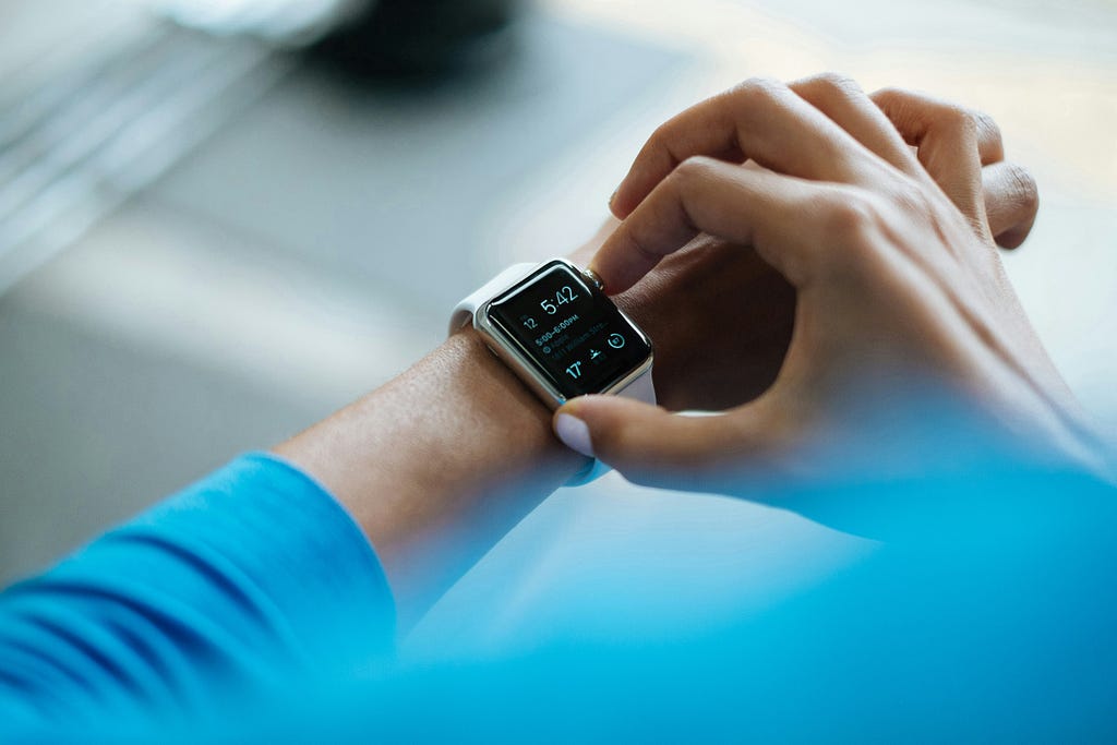 Someone checking a smart watch on their wrist