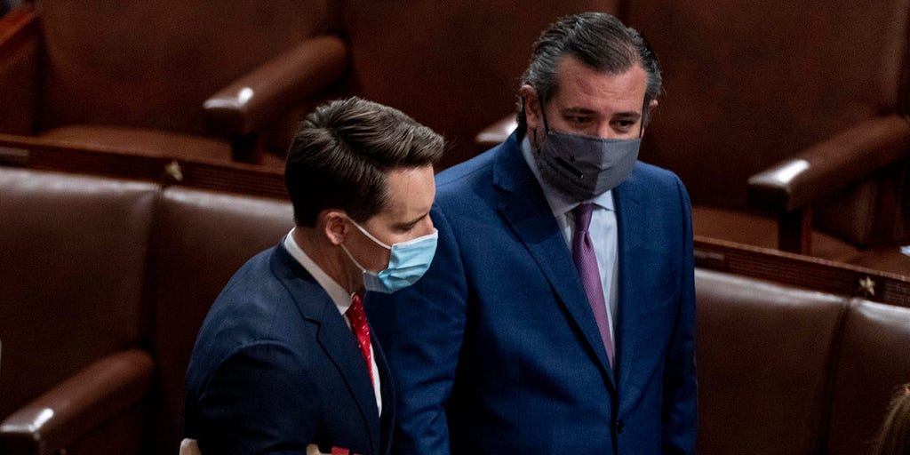 GOP Sens. Josh Hawley of Missouri, left, and Ted Cruz of Texas, right, speak after Republicans objected to certifying the Electoral College votes from Arizona during a joint session of Congress on January 6, 2021.