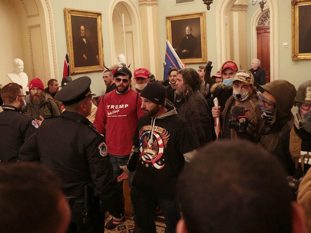 Protesters and Capitol Police officers inside the US Capitol on January 6.