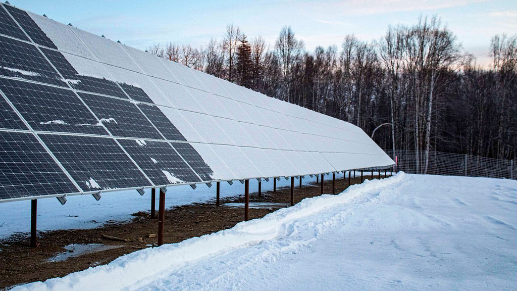 Alaska solar panels from which snow is partially