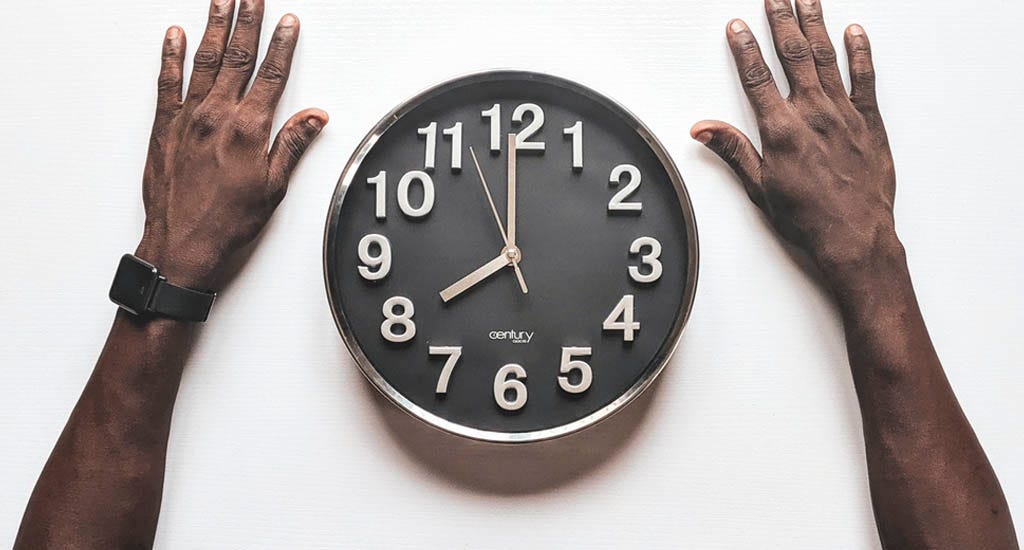 Entrepreneur observing time on clock