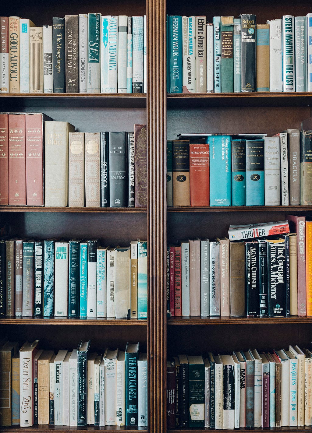 Bookshelf stacked with books.