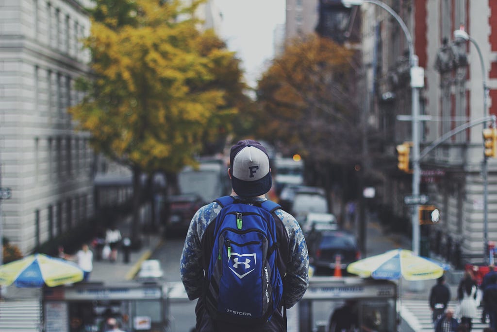 Young person looking out at the big city ahead