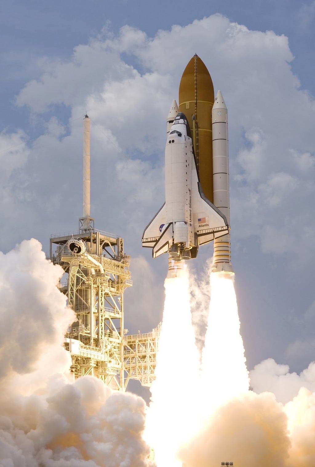 NASA space ship lifting off in a plume of smoke