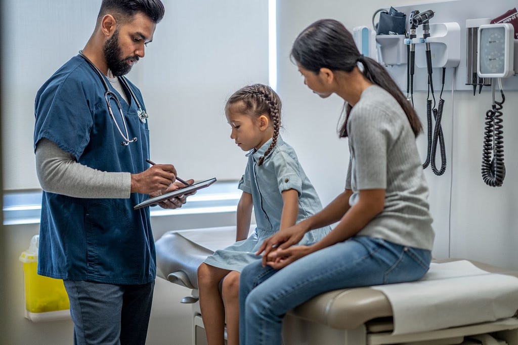 Young girl sees a doctor for genetic testing for neuromuscular disorders