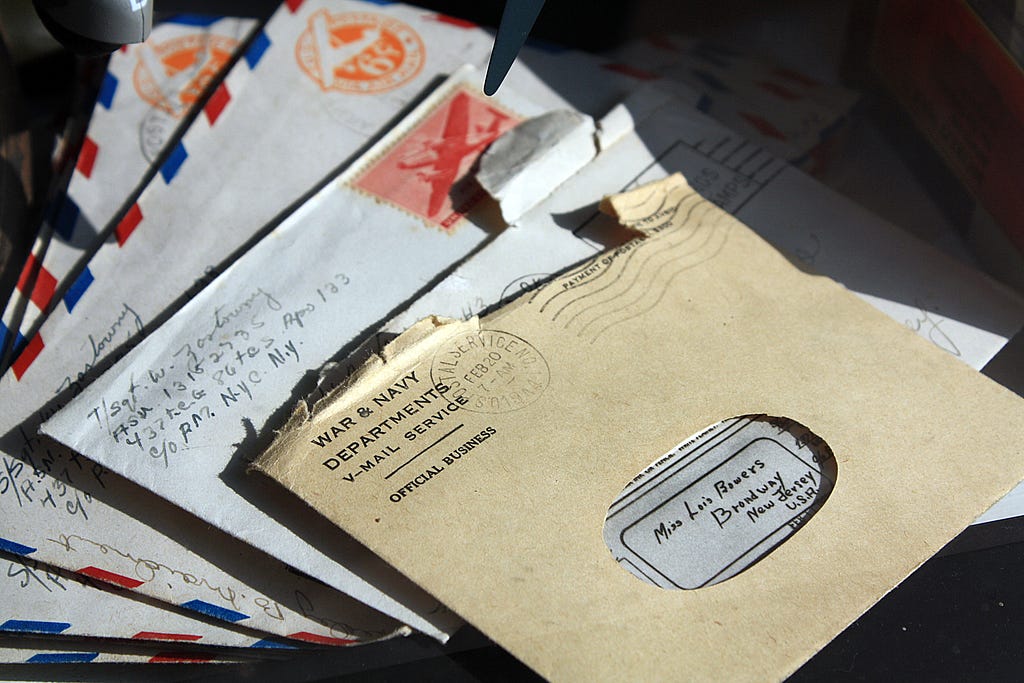 pile of vintage-looking letters, including some airmail envelopes.