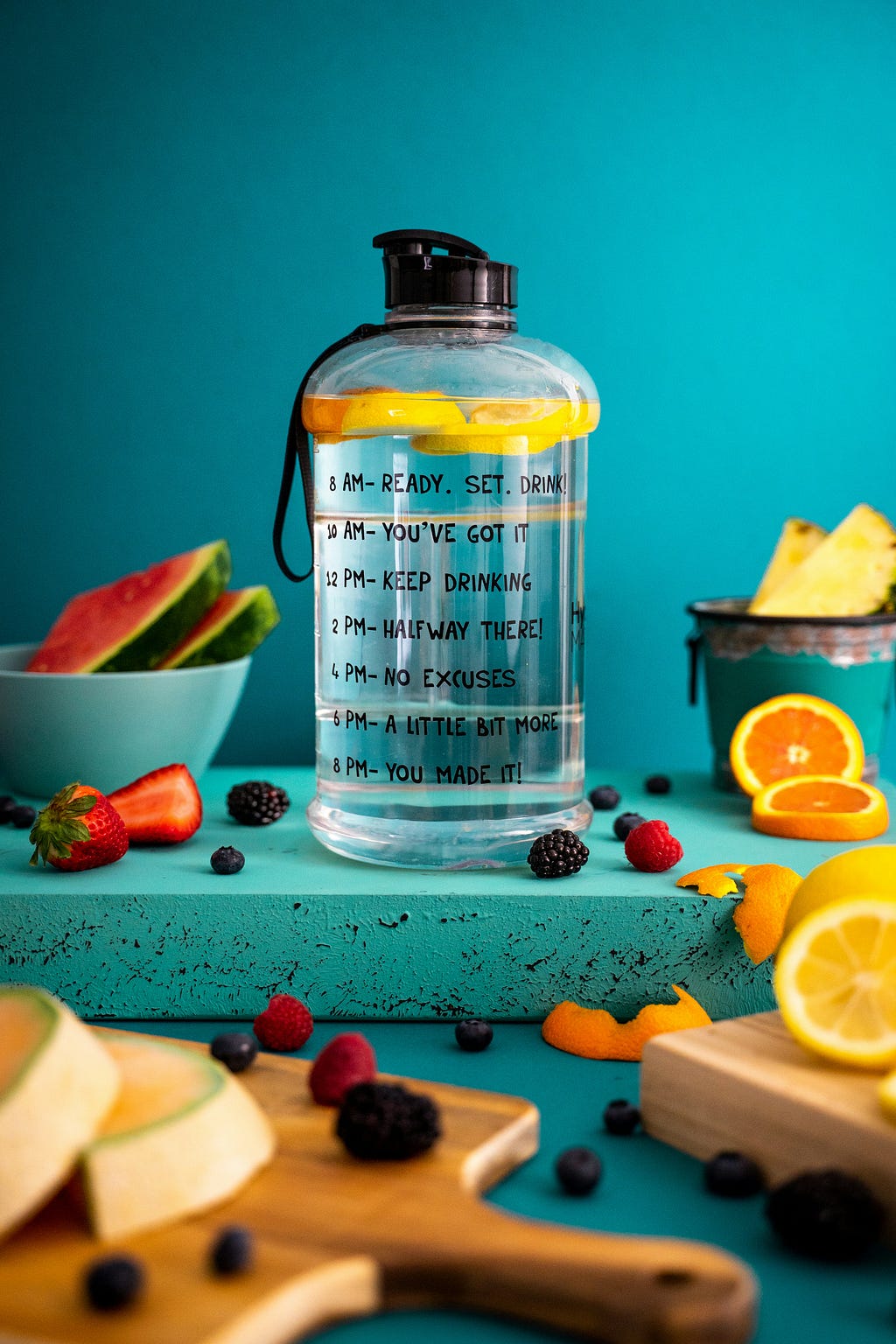 Product photography, motivational water bottle and fruits