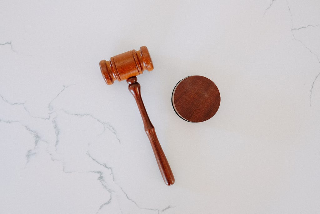 A gavel on a marble counter