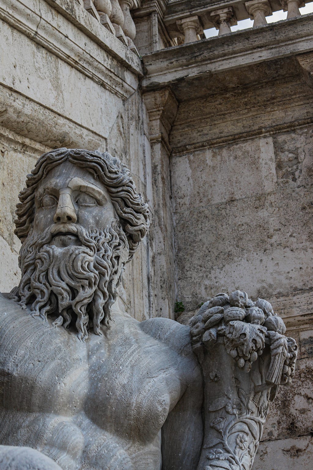 A close up of an ancient statue of Hercules.