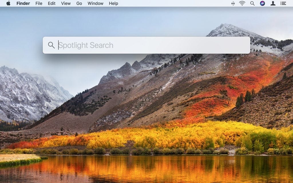 Spotlight Search is the magnifying glass in the top right of the screen