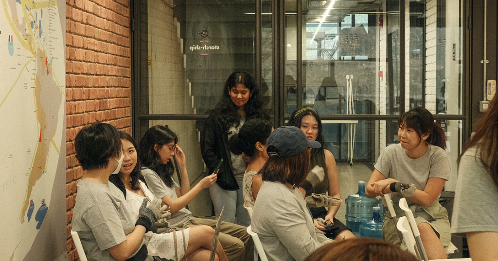 A group of people having conversations with one another