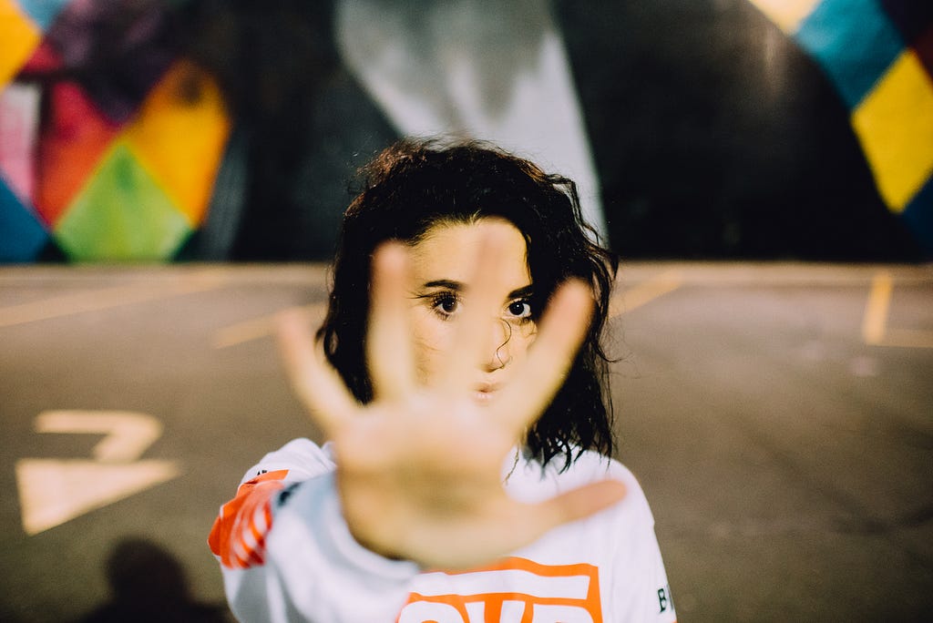 A women gesturing her hand outward