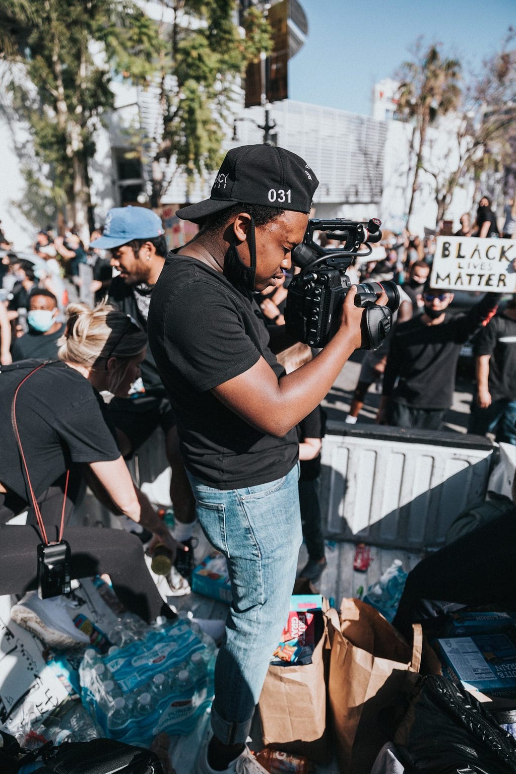 Image of a man taking pictures at a Black Lives Matter protest