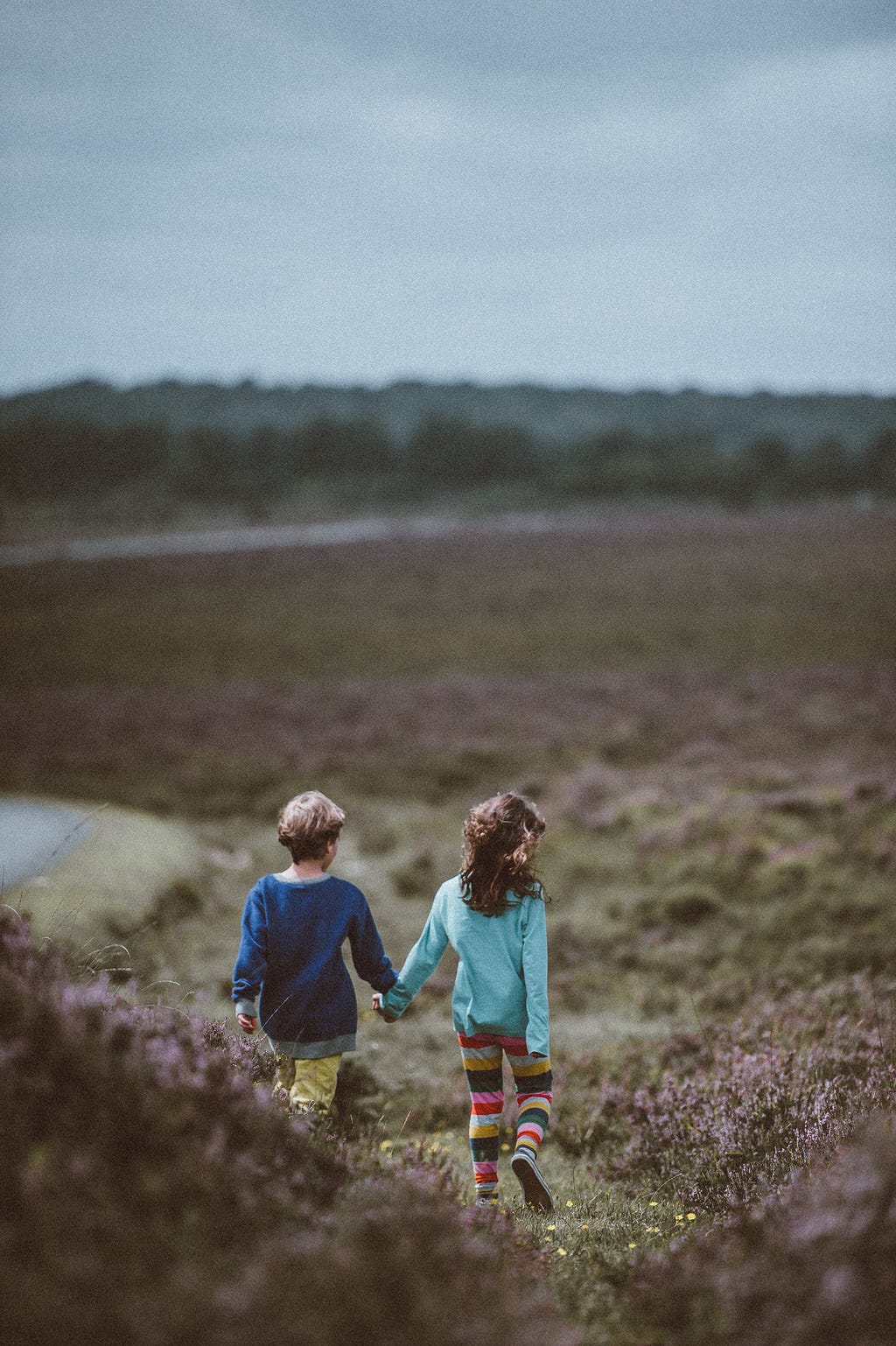 Two children walking a path in Nature