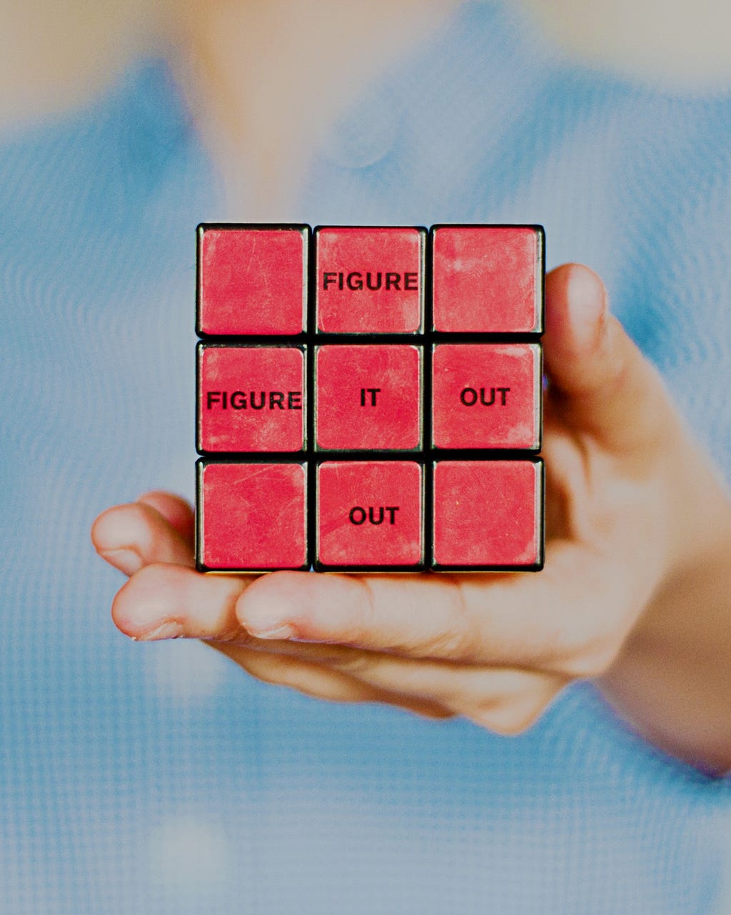 A rubik’s cube with the legend “Figure it out”