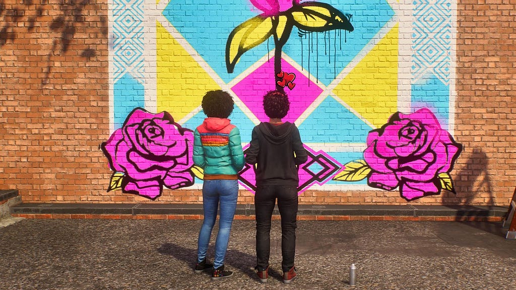 Hailey and the graffiti artist standing in front of their mural with hearts displayed above their heads.