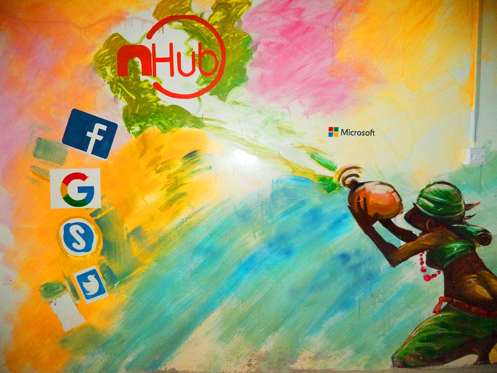 Social media icons on colorful wall, female figure