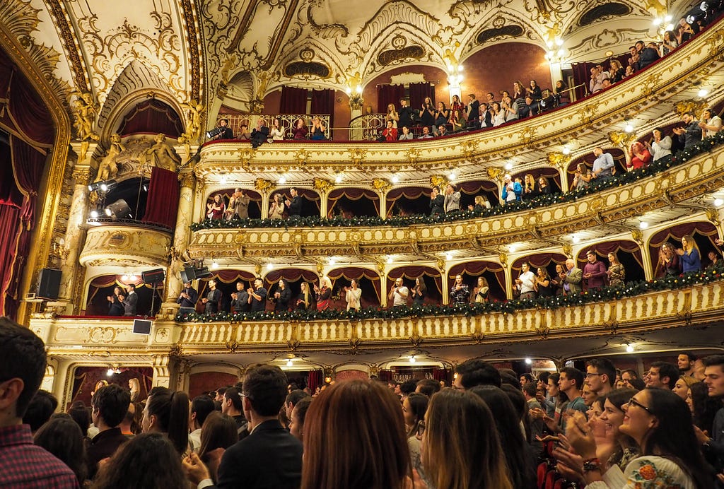 A standing ovation at an opulent venue.