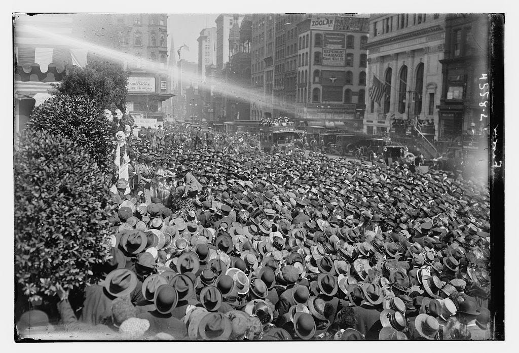 A group of men in the streets of New York wearing hats