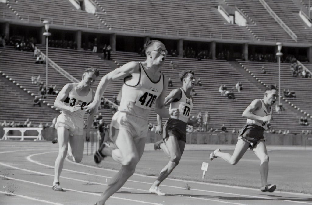 old photo of people racing on the running track