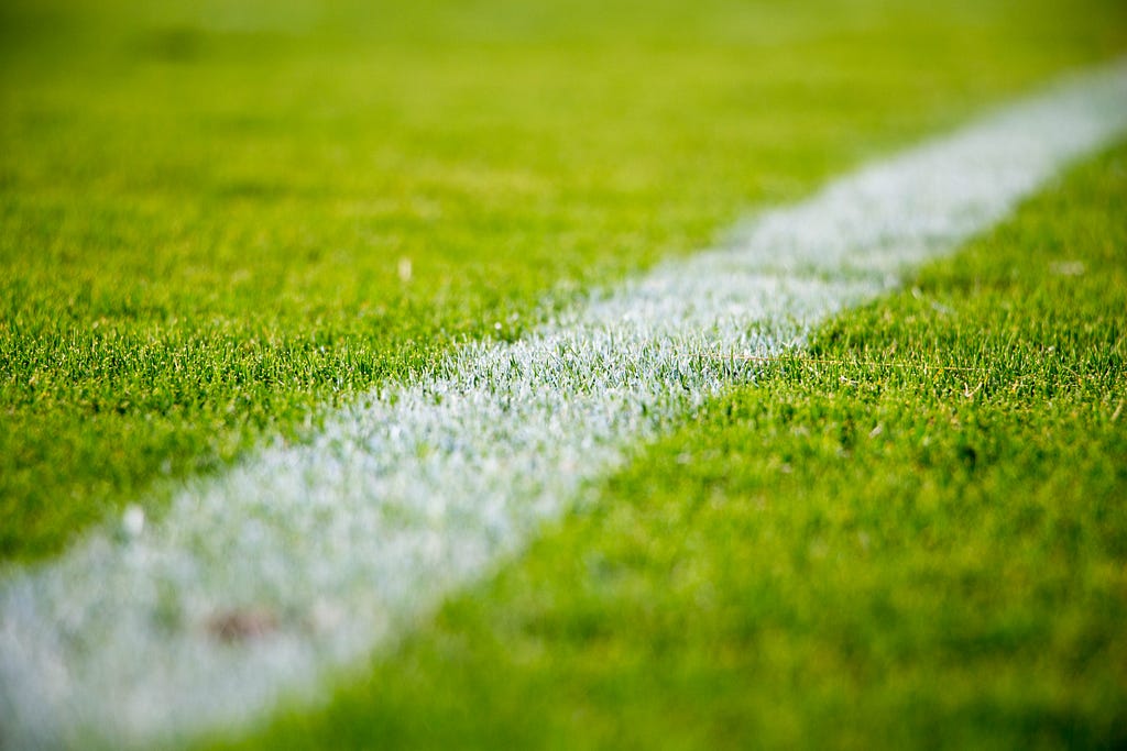 Image of a painted white line on a football pitch