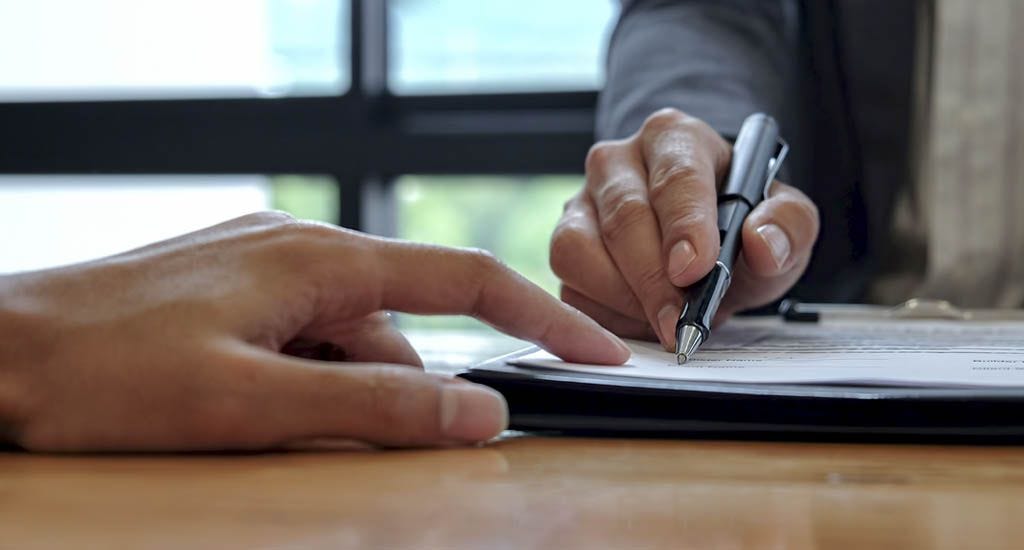 CEO signing legal business document